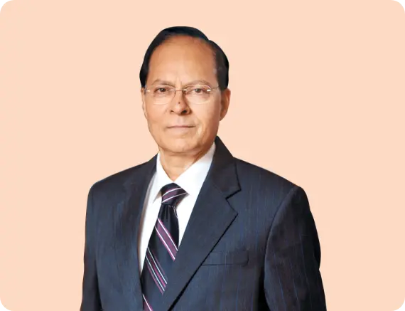 A formal portrait of Girish Chandra Chaturvedi, the Chairman, wearing a dark suit and tie, representing leadership and authority.