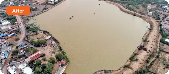 A photograph of a pond created at INS Dronacharya in Fort Kochi, Kerala, featuring a man walking along the edge of the pond with trees and greenery in the background, highlighting efforts to enhance the landscape and water management within the naval facility.