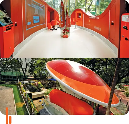 Two images showcasing ICICI Bank's new digital banking space called 'Digiverse' at BKC in Mumbai, Maharashtra. The interior image displays a modern, curved design with digital screens and bright orange accents, while the exterior image shows the unique architectural structure powered by green energy, emphasizing the bank's commitment to sustainability and innovative banking solutions.