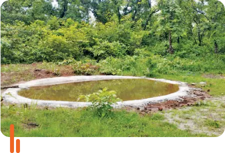 A photograph of a water saucer created in Umred Karhandla Wildlife Sanctuary, Maharashtra, providing a water source for wildlife in the sanctuary, promoting conservation and supporting biodiversity.