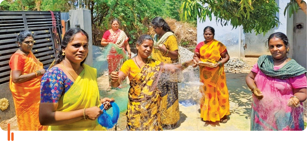 Members of the Meenvalai Thozhil Self-Help Group showcasing the fishing nets they made. The image shows a group of women standing together, holding and inspecting the nets they crafted