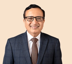 Portrait of Sandeep Batra, Executive Director of ICICI Bank, wearing a dark suit and tie, highlighting his role as a senior executive within the bank.