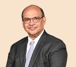 Portrait of Ajay Kumar Gupta, Executive Director of ICICI Bank, dressed in a dark suit and light-colored tie, highlighting his leadership position within the bank.