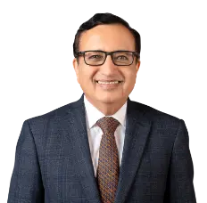 A professional portrait of Sandeep Batra, the Executive Director of ICICI Bank, wearing a formal dark suit, white shirt, and patterned tie, standing against a neutral background. The text below his image reads Sandeep Batra, Executive Director in white text on a red background.